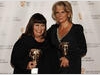 Dawn French and Jennifer Saunders celebrate receiving the Academy's highest honour, the Fellowship, at the British Academy Television Awards (BAFTA/ Richard Kendal).