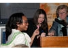 A lucky raffle winner shows her ticket at the Awards party in New York to Jasmine Rinde, event producer and CEO, Christina Thomas