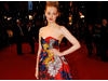 Actress Romola Garai poses on the Film Awards red carpet in a flowery Erdem dress and Miu miu shoes (BAFTA/Richard Kendal).