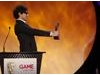 Alex Zane eagerly hands over the award for Gameplay category (BAFTA/Brian Ritchie)