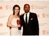 Kristen Stewart celebrates winning the Orange Rising Star Award with the winner in 2009, Noel Clarke (BAFTA/Richard Kendal).