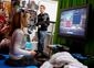 Workshop participants play LittleBigPlanet on screens provided for the event by Sony.
