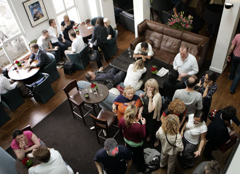 Members gather in the bar area at 195 Piccadilly.