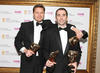 Evan Welles and Christophe Balestra celebrate their four BAFTAs for Uncharted 2: Among Thieves including masks in the Use of Audio, Original Score, Story and Action categories (BAFTA/Steve Butler).