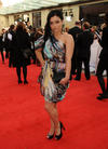 The EastEnders star is wearing Matthew Williamson from our Official Stylist WishWantWear. (Pic: BAFTA/Richard Kendal)