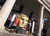 Film fans pose next to a giant BAFTA Mask in the Covent Garden Piazza (pic: Marc Hoberman).