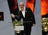 Harry Hill celebrates his BAFTA win at the British Academy Television Awards. 