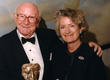 Sir Bill Cotton with his BAFTA Fellowship in 1998, pictured with his wife Lady Burgess.