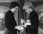 Rowan Atkinson accepts his award for Best Light Entertainment Performance from Sting in 1981.