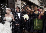 Outside BAFTA’s wedding venue, guests throw confetti