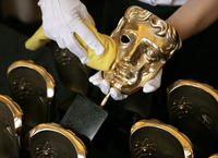BAFTA masks are polished before the Orange British Academy Film Awards. Film Masks