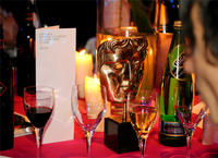 The BAFTA mask at the Orange British Academy Film Awards dinner at Grosvenor House. Film Awards Dinner Table