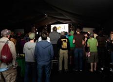 July 16: Audience members at the back of the arena determined to see Chris Morris on stage (Picture: Jonathan Birch)