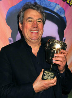 Eric Idle poses with his BAFTA Special Award at the Monty Python Reunion Event in New York on 15 October 2009 (© BAFTA)