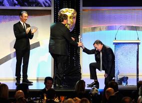 Robin Williams presents John Lasseter with his Britannia Award.