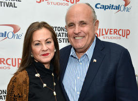 Judith Nathan (L) and Rudy Giuliani attend the 21st Annual Hamptons International Film Festival on October 12, 2013 in East Hampton, New York. (Photo by Eugene Gologursky/Getty Images for The Hamptons International Film Festival)