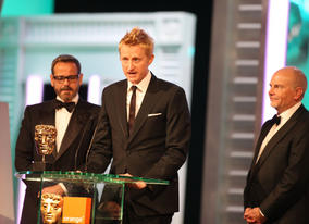 Guy Hendrix Dyas, Larry Dias and Doug Mowat take the BAFTA for their exceptional work on Inception. (Pic: BAFTA/ Stephen Butler)