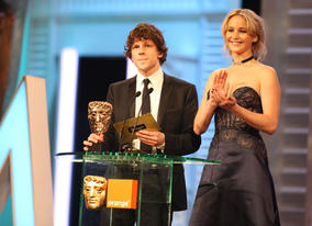 Jesse Eisenberg (The Social Network) and Jennifer Lawrence (Winter's Bone) announce the Special Visual Effects winner. (Pic: BAFTA/ Stephen Butler)