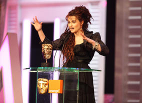 Helena Bonham Carter accepts the BAFTA for her role in The King's Speech. 