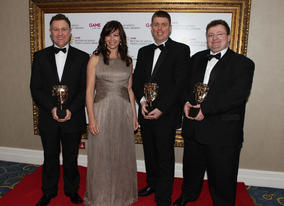 Piers Jackson, Mark Green and Leo Cubbin celebrate winning the Handheld category for Little Big Planet on the PSP with The Gadget Show's Suzi Perry (BAFTA/Steve Butler).