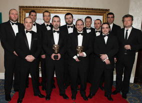 The developpment team behind Batman: Arkham Asylum, including Sefton Hill and Jamie Walker, proudly display the coveted Best Game BAFTA (BAFTA/Steve Butler).
