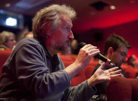 An audience member shares his ideas with the industry panel.