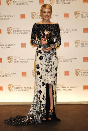 Star of An Education Carey Mulligan poses with her award for Leading Actress (BAFTA/Richard Kendal).