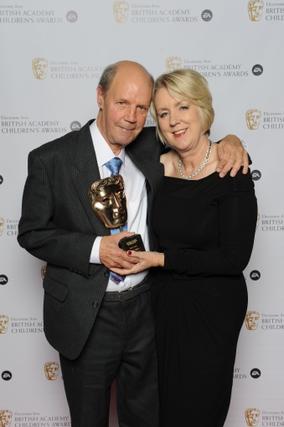 Brian Cant celebrates winning the BAFTA Special Award with his wife Cherry. Pic: BAFTA/Richard Kendal