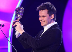 Adam Shaw from Blue Zoo animation studio collects the Academy's Break-through Talent Award. 