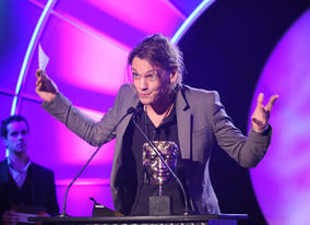 Actor Jamie Campbell Bower - known for his role in Sweeney Todd and as Gellert Grindelwald in Harry Potter and the Deathly Hallows - presents the Feature Film Award. 