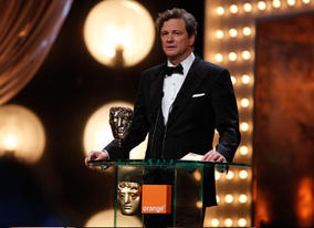 Colin Firth, nominee in the Leading Actor category for A Single Man, presents the first award of the evening, for Outstanding Debut by a British Writer, Director or Producer (BAFTA/Brian Ritchie)