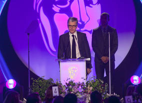 The Original Music BAFTA is won by Brian Eno for Top Boy. Show producer Alasdair Flint accept the award on his behalf.