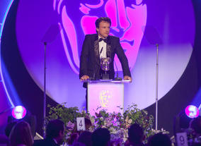 Jonathan Firth presents the award for Director: Fiction sponsored by Production Base.