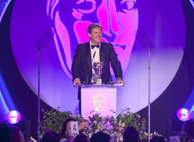 Actor, Adrian Dunbar presents the Special Award to Colourist, Aidan Farrell.