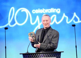 Neville Kidd accepted the Photography Factual BAFTA for his work on the BBC series A History of Scotland (BAFTA / Richard Kendal).