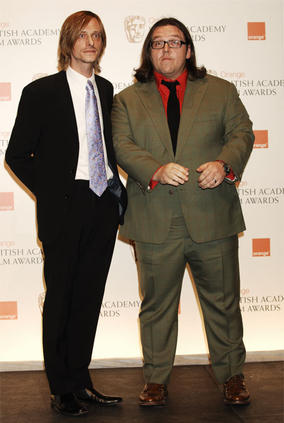 Nick Frost and Mackenzie Crook, presenters of the Special Visual Effects award, pose foir the waiting cameras backstage (BAFTA/Richard Kendal).