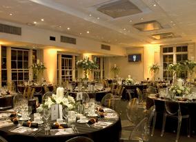 Clear chairs add a modern twist to the classic decor