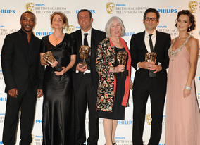 Kara Tointon and Ashley Walters presented the Drama Serial BAFTA to the production team behind Any Human Heart: Lynn Horsford, Lee Morris, Sally Woodward Gentle and Michael Samuels. (Pic: BAFTA/Richard Kendal)