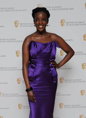 Actress Wunmi Mosaku arrives in style to present the Costume Design Award.