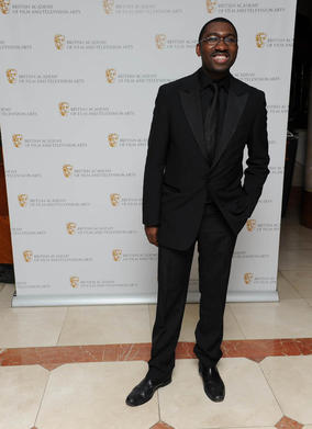 Singer, playwright and broadcaster Kwame Kwei-Armah arrives to present the Original Television Music Award. 