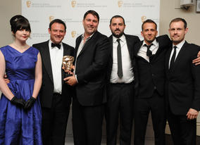 Presenter Ben Price with the winning visual effects team from The Mill, who were also nominated for Doctor Who but won for Merlin. (Pic: BAFTA/Chris Sharp)