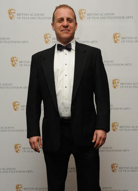 Actor Nigel Lindsay (pictured) announced Jason Savage as the winner, for his work on the Arctic episode of Human Planet. (Pic: BAFTA/Chris Sharp)