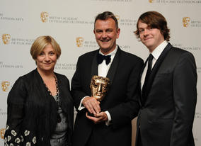 BAFTA-winning writer Peter Bowker with Eric And Ernie exec producer Victoria Wood and star Daniel Rigby. (Pic: BAFTA/Chris Sharp)
