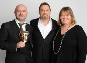 Presenter Eddie Izzard with CBBC's Cheryl Taylor and Damian Kavanagh.