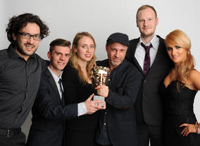 Presenter Aliona Vilani with the winning team behind Seeking Refuge, including Andy Glynne.