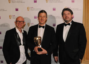 TV presenter and children's author Jason Bradbury and Archer Maclean, legendary programmer and founder of Awesome Play Ltd, presented the Technical Achievement Award to Keith Ramsdale for Spore (BAFTA / James Kennedy). 