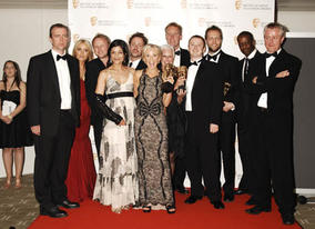 Citation readers Patsy Kensit-Healy and Adrian Lester with the cast of The Bill, winners of the Continuing Drama BAFTA at the British Academy Television Awards in 2009 (BAFTA/Richard Kendal).