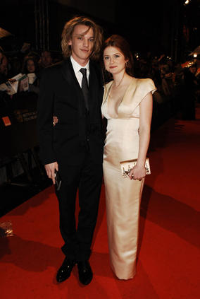 Star of Harry Potter, Bonnie Wright, walks down the carpet in a Prada dress (BAFTA/Richard Kendal).