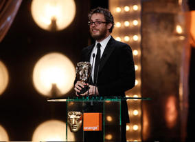 Duncan Jones makes an emotional acceptance speech after winning the award for Outstanding Debut by a British Writer, Director or Producer for his film Moon (BAFTA/Brian Ritchie).