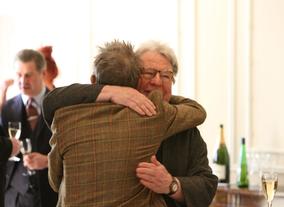 John Hurt greets Alan Parker. The two worked together on Midnight Express which Parker directed in 1978. 